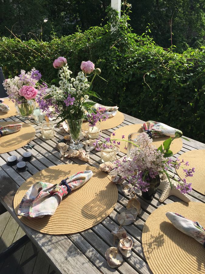 Outdoor lilacs on woven placemats
