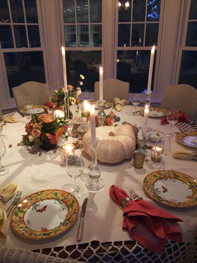 Fall evening, tall candles, pumpkin