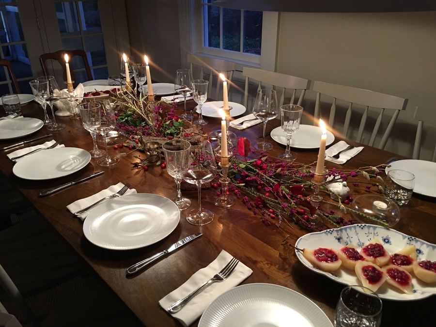 Thanksgiving, long dark table, berries and candles