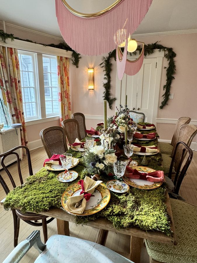 Dining room with foraged moss runner and greenery swag