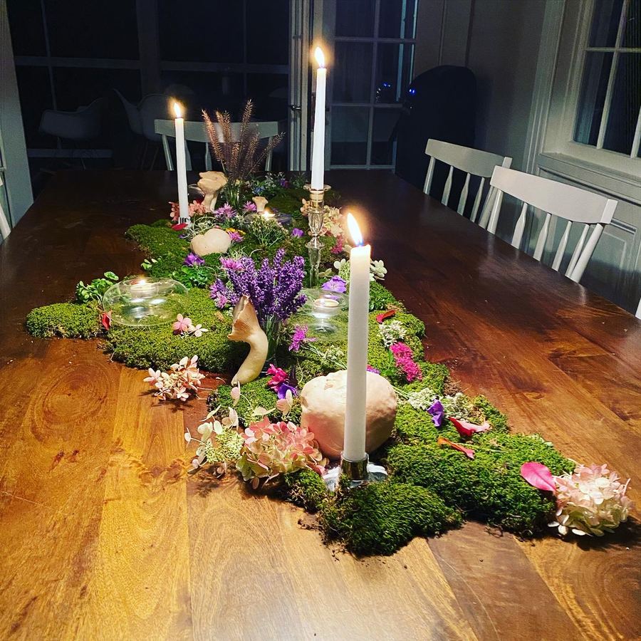 Moss centerpiece at night, candlelit