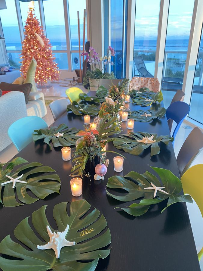 Christmas in Miami, monstera leaves, starfish, votives, pink tree