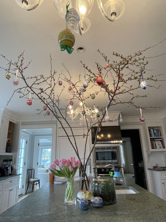 Spring branch tree with eggs over kitchen island