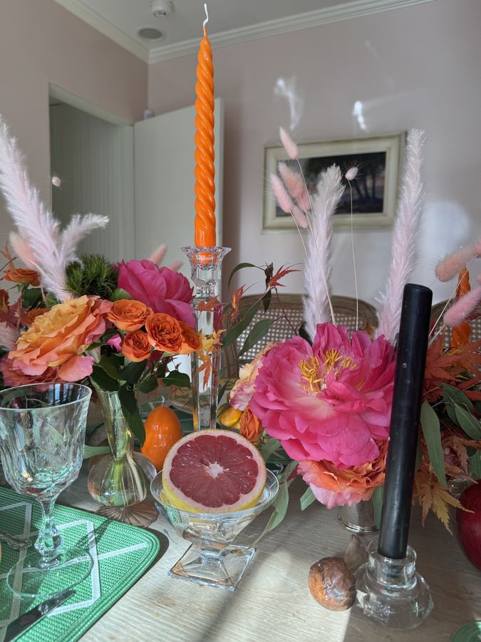 Close, grapefruit, pink peony, orange taper