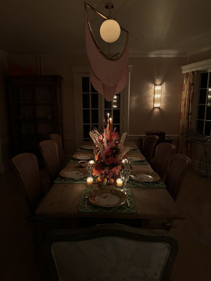 Thanksgiving long table, dim, candlelit