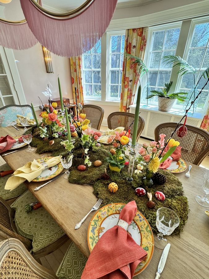 Easter place setting with moss, orange napkin, Hermès