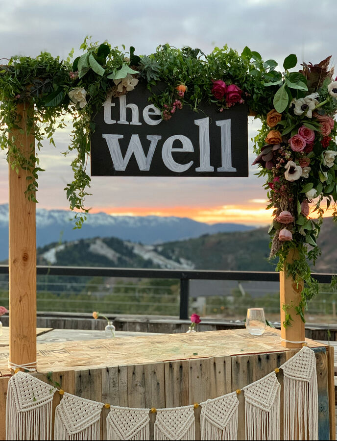The Well, Powder Mountain: flower-covered sign at sunset