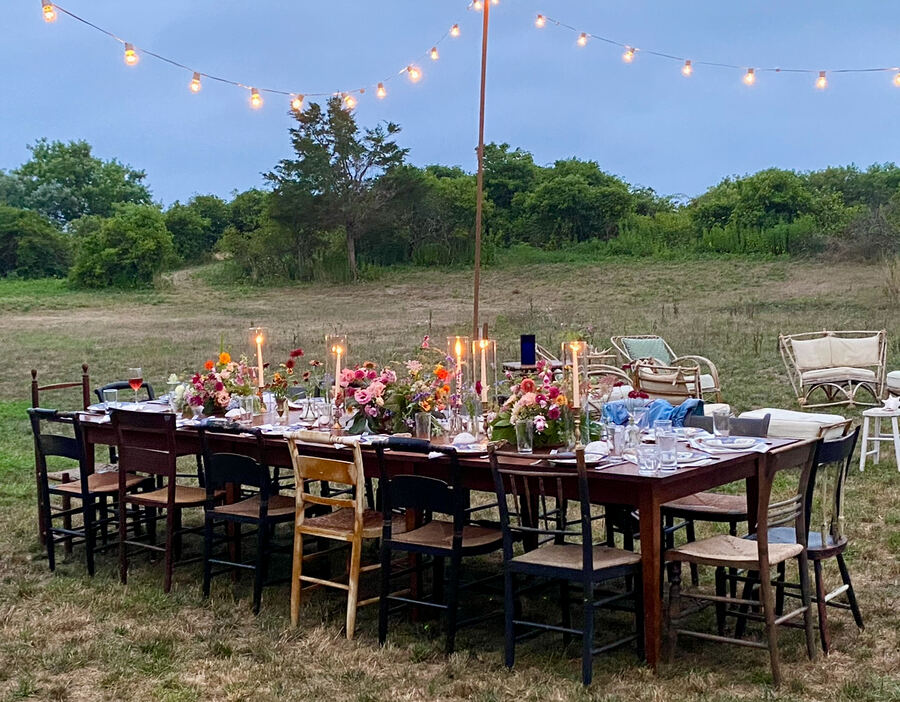Martha's Vineyard: long table in the field under string lights